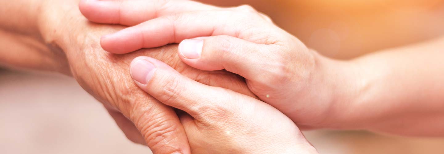 Two hands holding each other